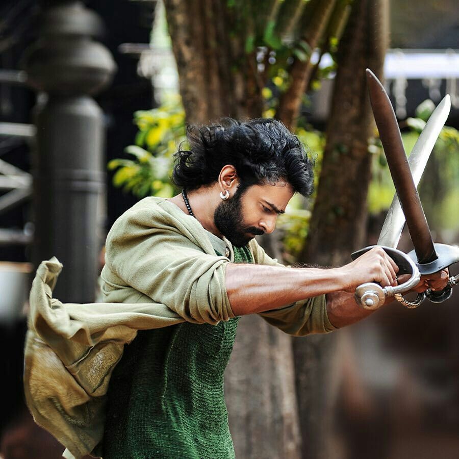 Prabhas — cinematic black and gold portrait